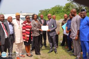 UNILAG VC, Prof. Ogunsola, OON, FAS, handing over the site certificate to Engr. (Dr.) Lukman Taiwo of TETFund